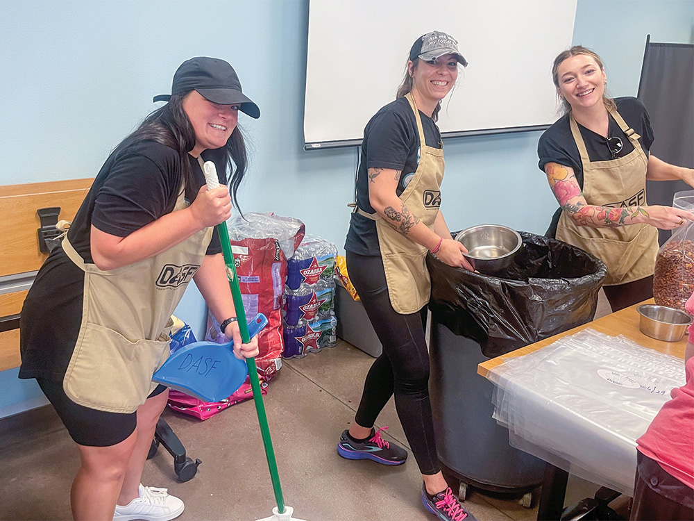 Ashtin Pizarro (left) volunteering at the Denton Animal Support Foundation’s Food Bank. Photo submitted by ASHTIN PIZARRO