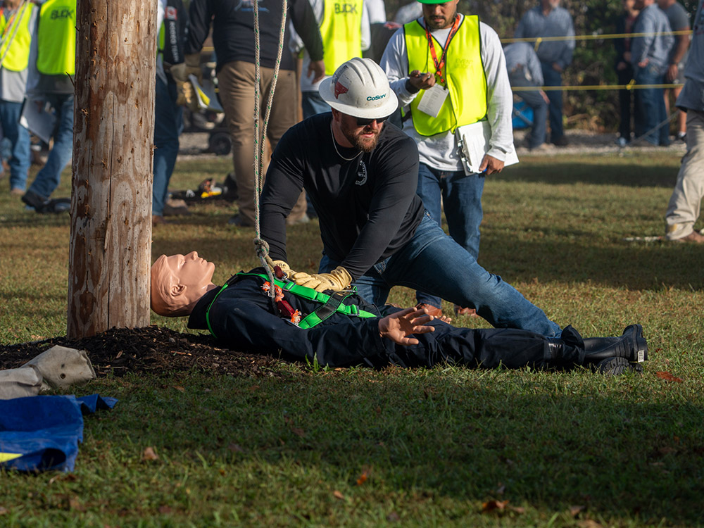 CoServ Journeyman Garrett McFerren gives aid to the practice dummy during the Hurt Man Rescue. 