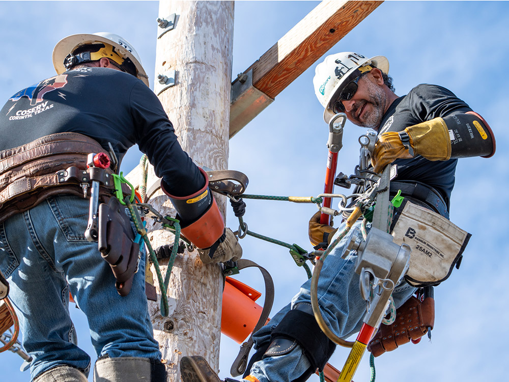 CoServ Journeyman Chris Hammonds and Alex Garza compete in the 2025 International Lineman's Rodeo. 
