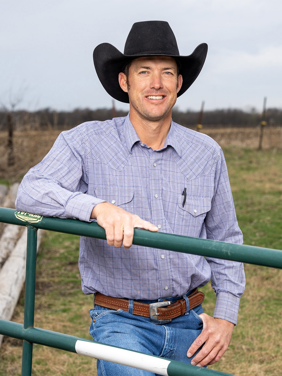 At the gate of his year‑round bull pasture, Scott Schumacher relies on CoServ’s electric hot wire to contain the herd.